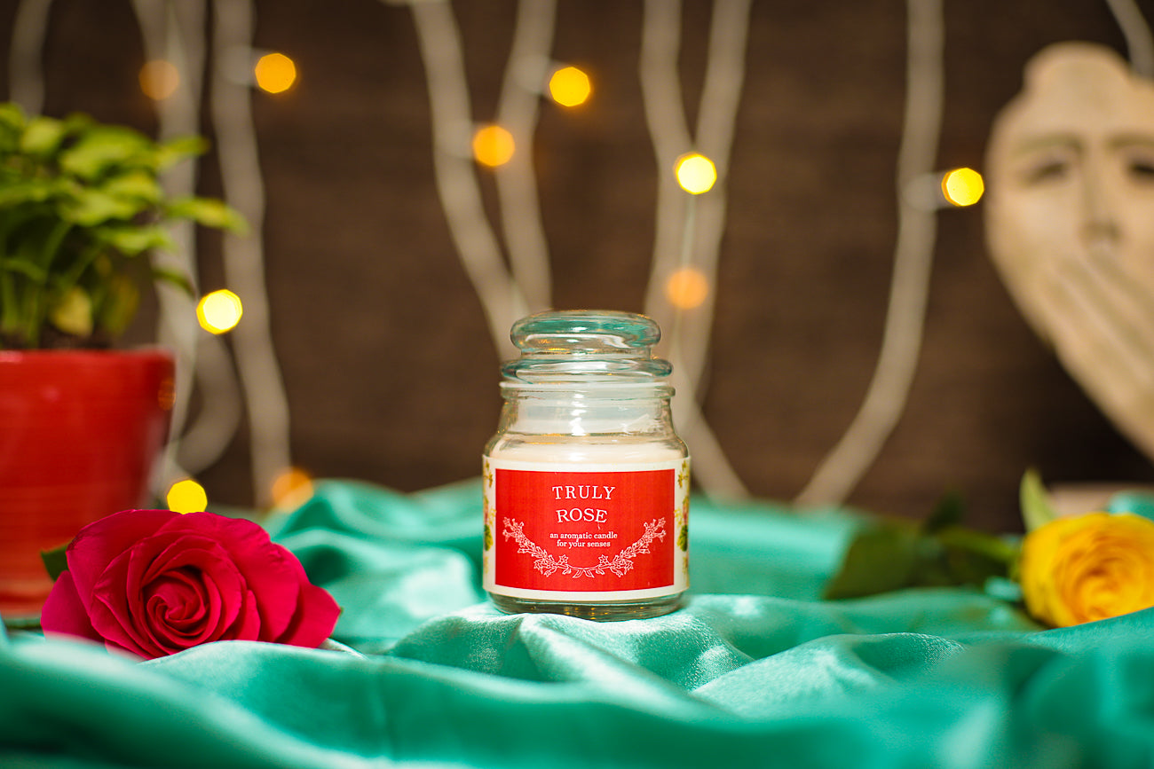 A luxurious Rose Aroma Candle, filling the air with the delicate scent of fresh roses