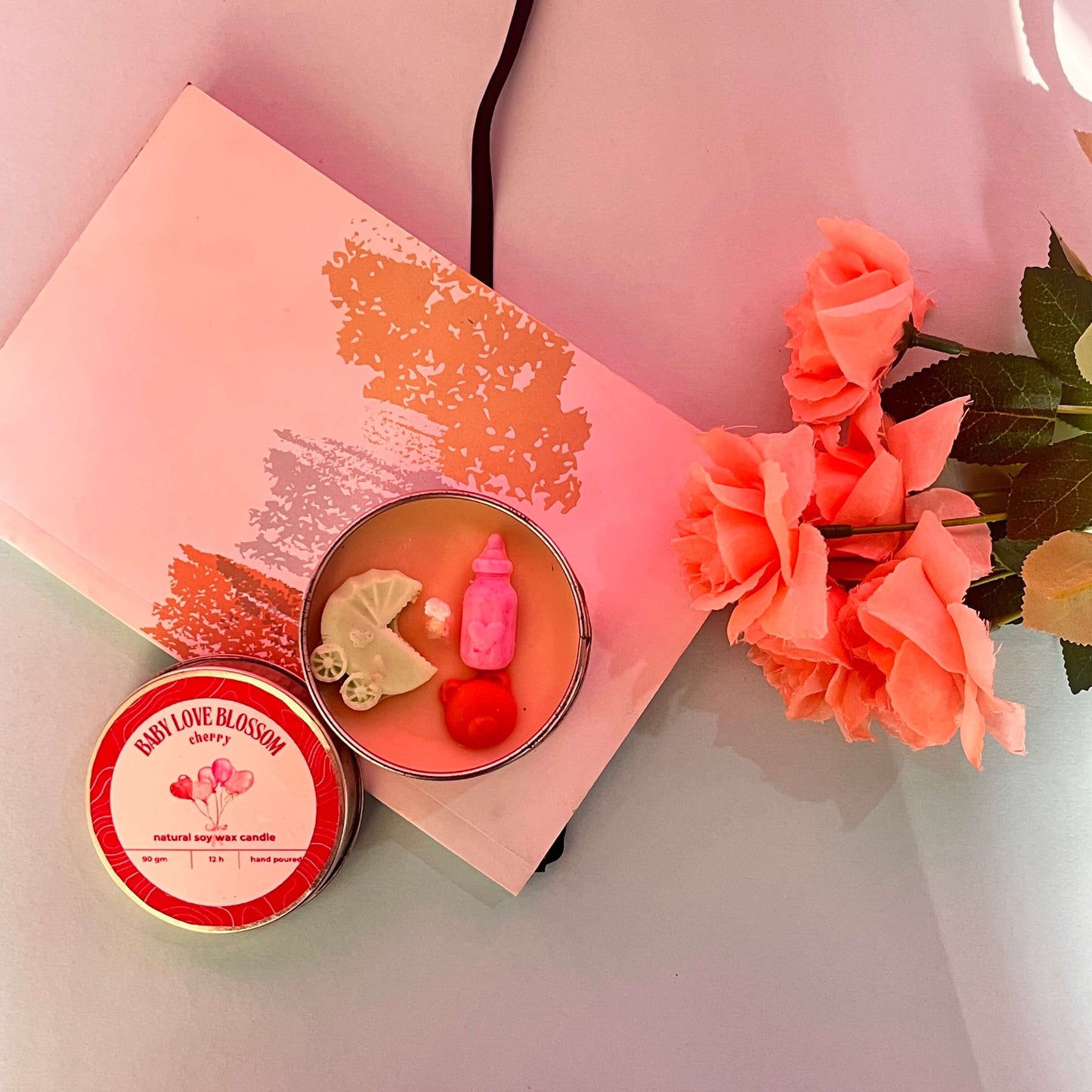 Scented Illume candle for baby shower décor – warm glow and delightful aroma