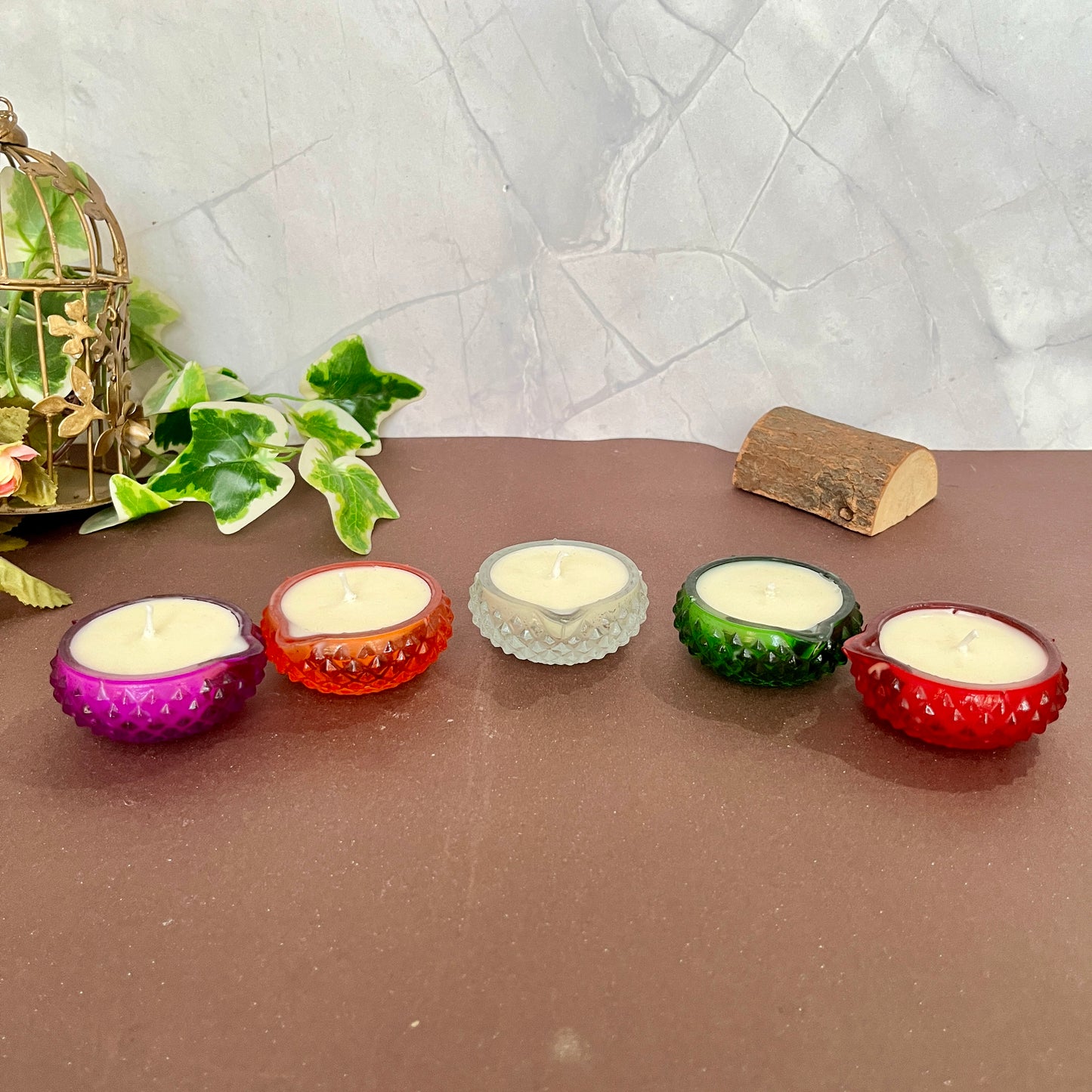 A traditional diya candle flickering in the darkness, symbolizing light and positivity