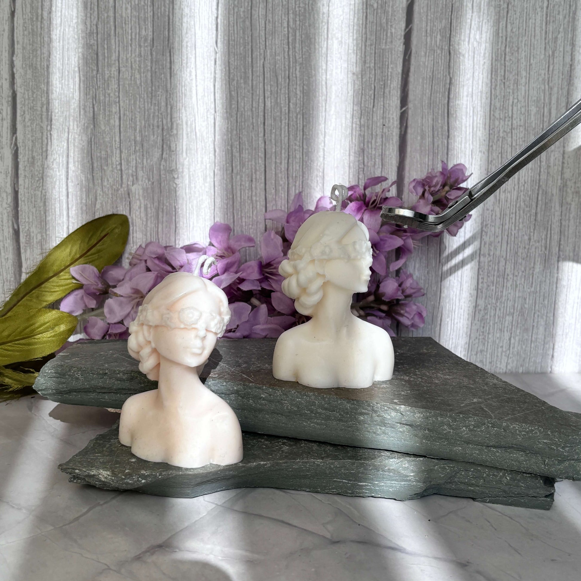 Symbolic blindfold lady candle, blending art and home aesthetics