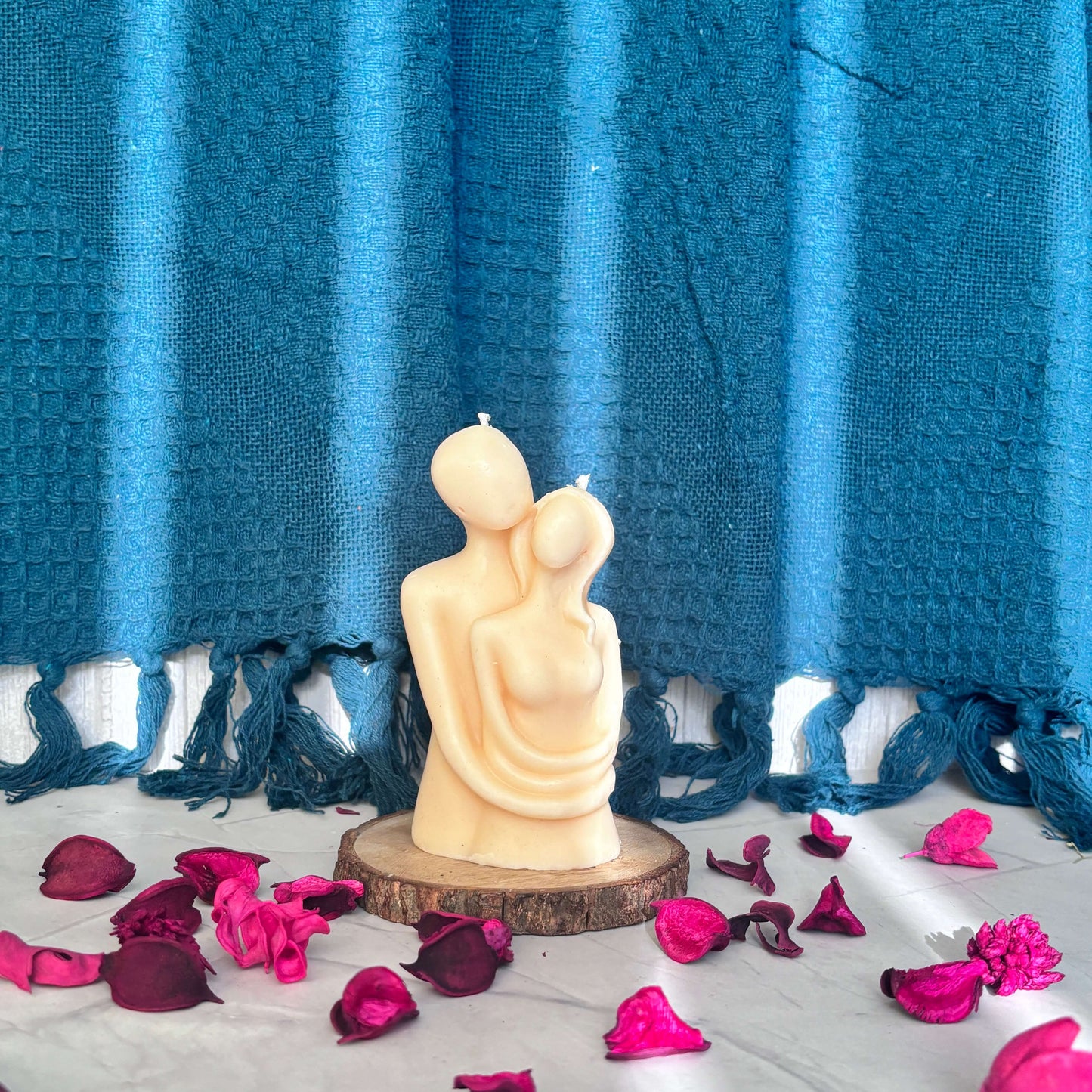 Handcrafted couple embrace candle symbolizing love and togetherness