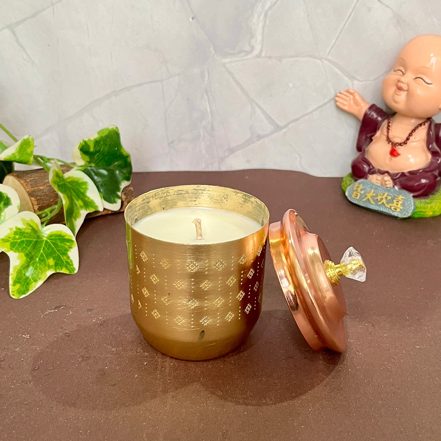 Handcrafted Ujiyaara Candle, glowing with soft light and infused with a soothing aroma for peaceful moments.