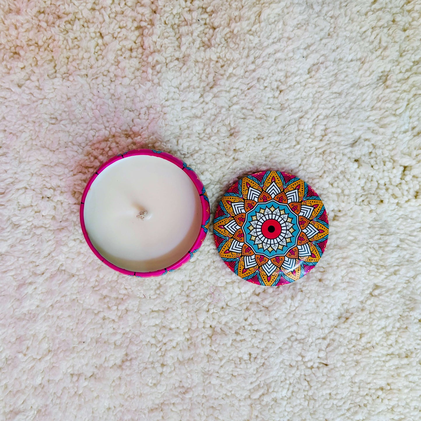 Softly glowing Mandala Illume Candle, casting mesmerizing shadows