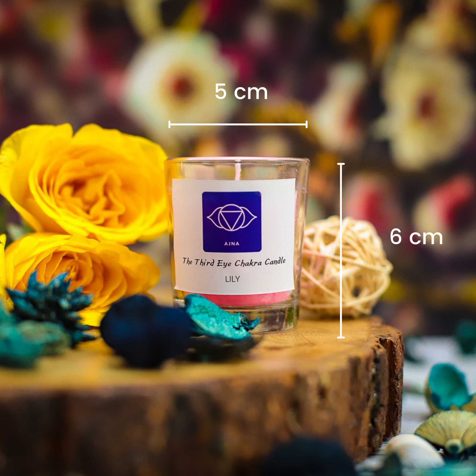 A beautifully crafted chakra candle set, presented in an elegant wooden box.