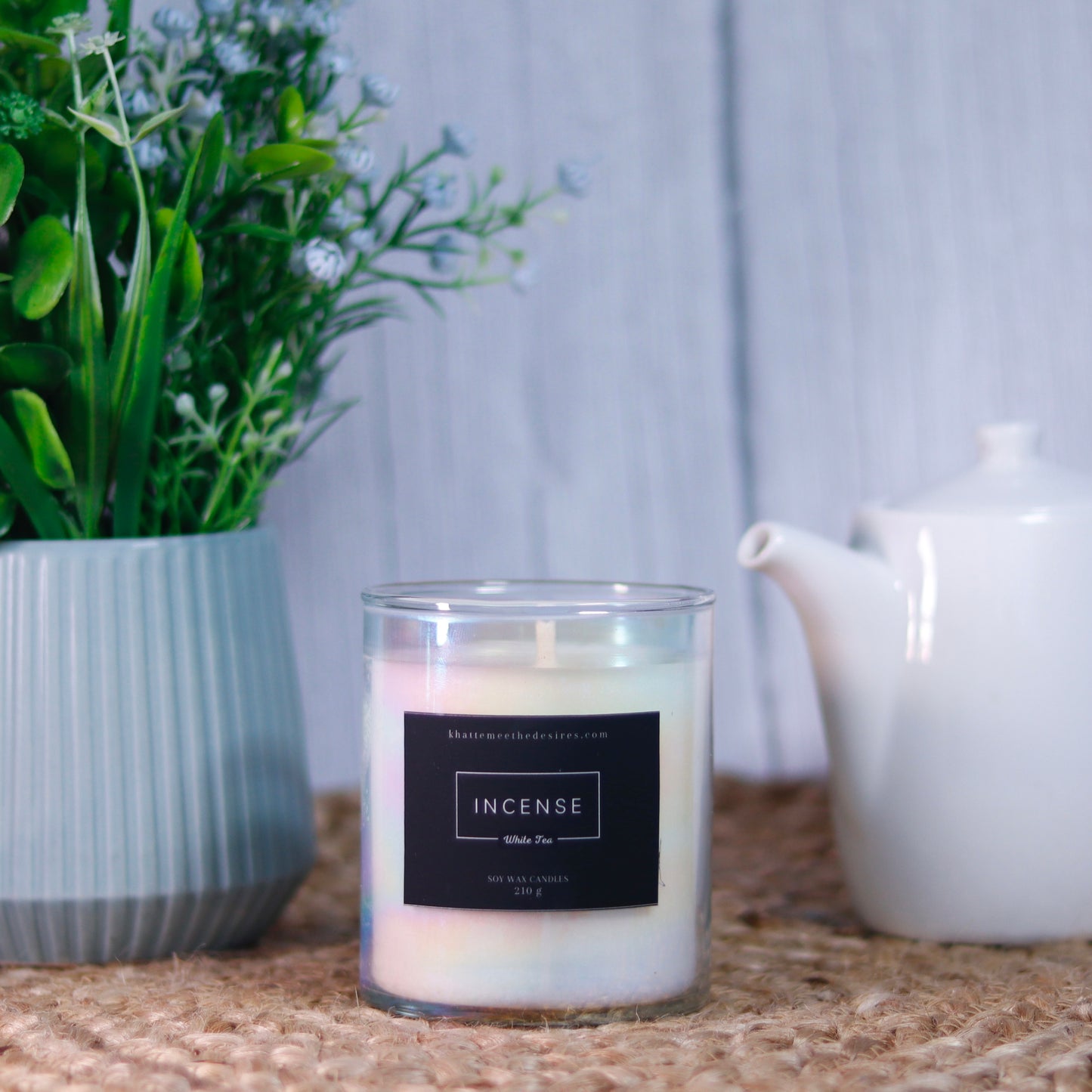 A hand-poured incense candle in an elegant jar, exuding warmth and tranquility