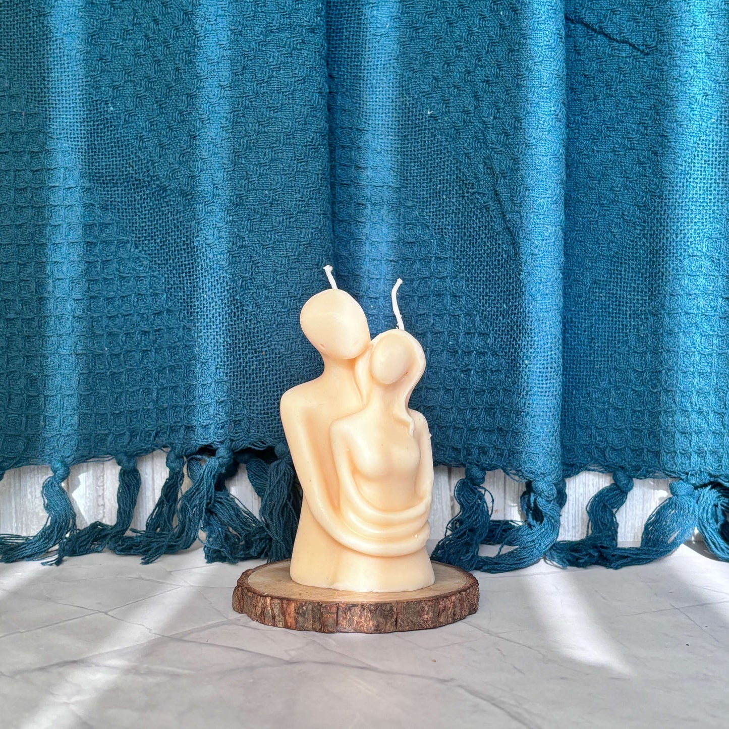 Artistic couple-shaped candle for a warm, romantic glow
